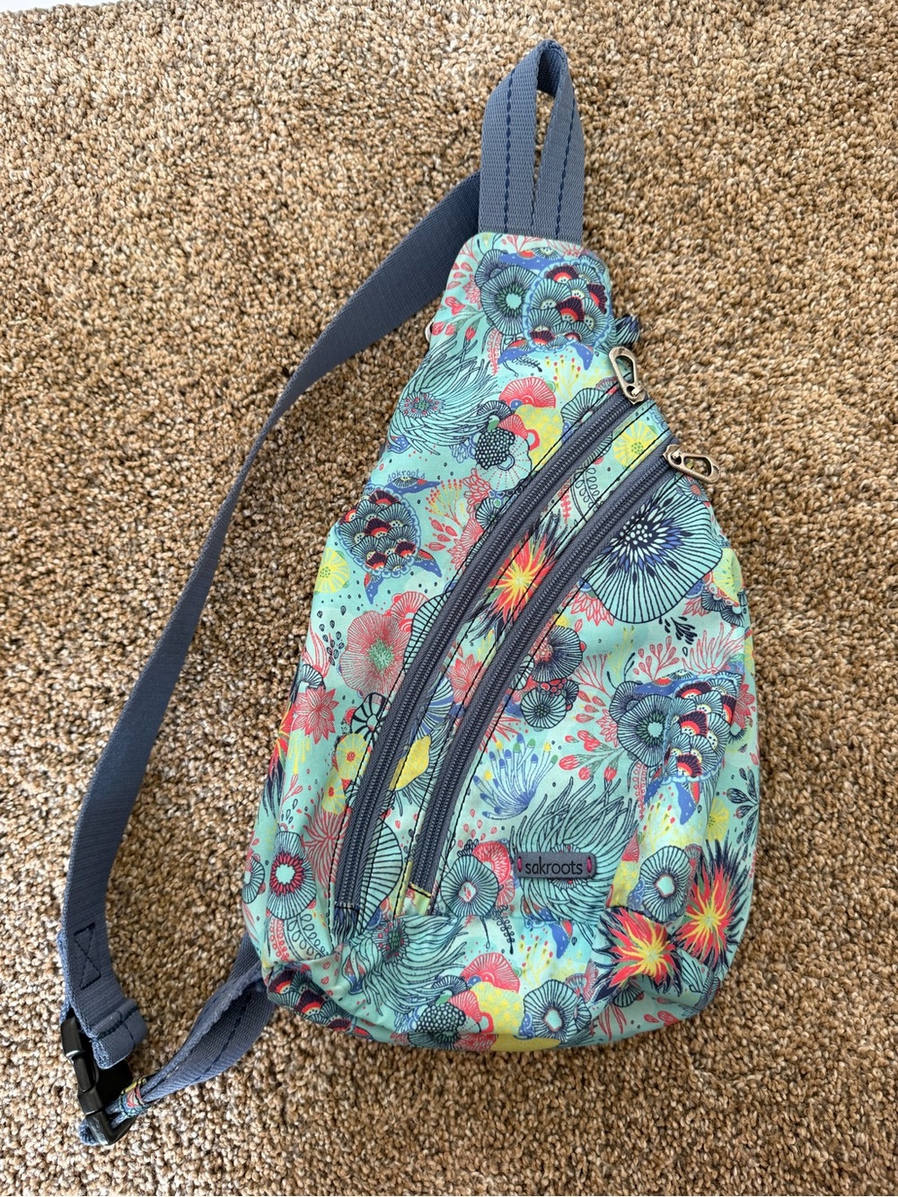 SAKROOTS On-The-Go Sling Backpack in Teal Floral Print